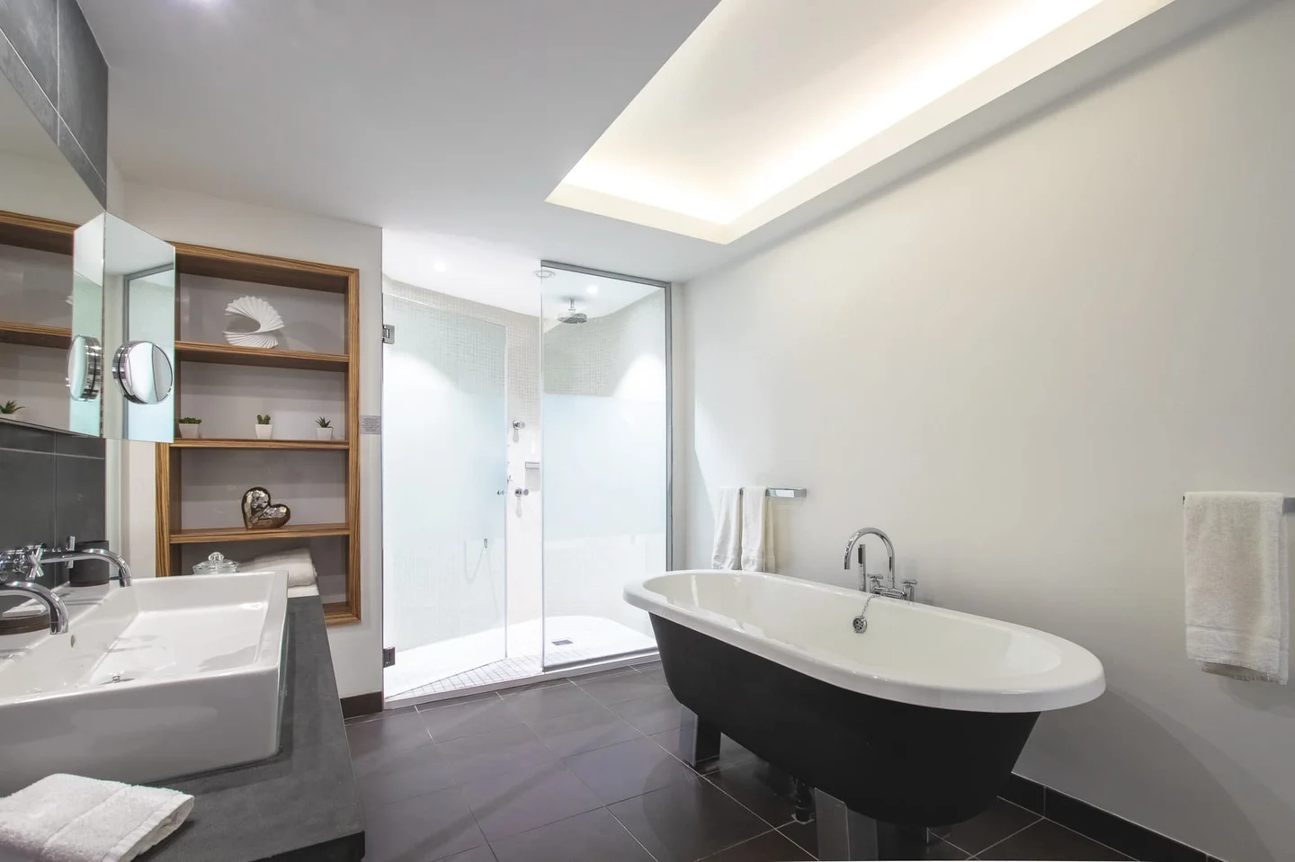 a bathroom with a bathtub and a shower